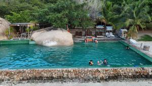 a group of people in a large swimming pool at Sao Biển Cam Ranh - Starfish Cam Ranh in Cam Ranh