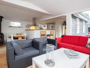 a living room with two couches and a table at 6 person holiday home in Gørlev in Gørlev