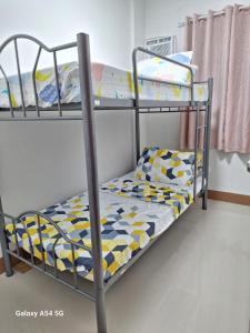 a bunk bed in a room with a bunk bed at Casa Alegre Lipa in Lipa