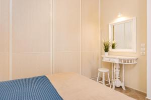 Llit o llits en una habitació de Agora Apartment