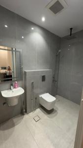 a bathroom with a sink and a toilet and a shower at نايس لوكيشن in Taif