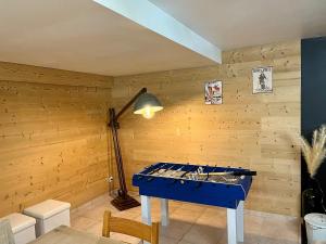 a blue ping pong table in a room at La Jassette 7 in Saint-Pierre-dels-Forcats