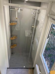 a shower with a glass door in a bathroom at L'écureuil in Piriac-sur-Mer +23 photos