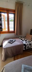 a bedroom with two beds and a window at Apartament La Mata -Maya Bungalow in Torrevieja