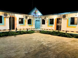 an empty building with colorful doors at night at Aj cotteg Lonavla malavali in Malavli