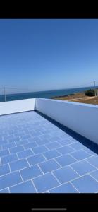 a view of the ocean from the top of a roof at Aqoua private villa in Tétouan