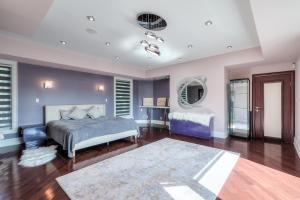 a bedroom with a bed and a table and a mirror at Private Oasis in King City in King City