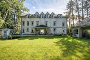 a large white house with a large yard at Private Oasis in King City in King City