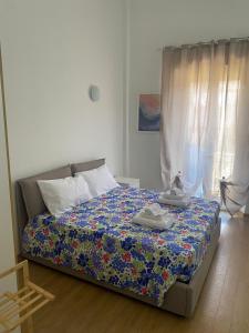 Ένα ή περισσότερα κρεβάτια σε δωμάτιο στο EMMEVI House