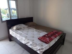 Postel nebo postele na pokoji v ubytování Sarava Residency