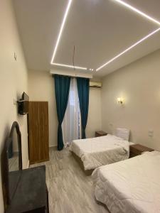 Postel nebo postele na pokoji v ubytování Cairo Villa Hotel