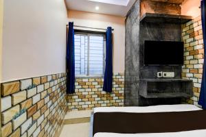 Postel nebo postele na pokoji v ubytování Hotel O Sana