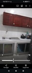 a close up of a kitchen with a microwave at Appartement meublés de luxe in Dakar