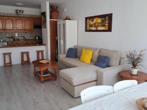 a living room with a couch and a table at Tabaiba Place in Tías +14 photos