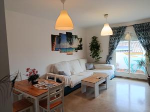 a living room with a couch and a table at Plaza de la Vendimia in Manilva