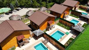 an aerial view of a house with two swimming pools at İstanbuldere Alabalık in Sapanca