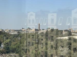a view of a city from a hill with trees at Minar Luxrury 2BR Apartment - near Old City in Bukhara +26 photos