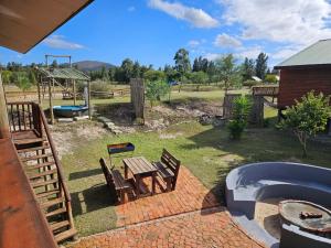 a backyard with a picnic table and a playground at The Barnard's Barnyard in Malmesbury