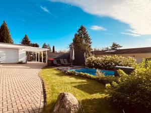 Κήπος έξω από το Waldhaus Harz, Natur pur mit Pool, Sauna und traumhaften Garten