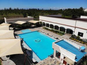 an overhead view of a swimming pool in a building at Lamuria Naserian Villa in Nanyuki