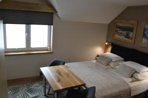 Una cama o camas en una habitación de Apartmány Špacír celý dům