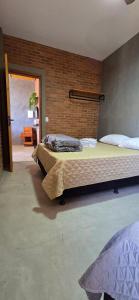 Postel nebo postele na pokoji v ubytování Villa da Serra Ibitipoca 2 quartos