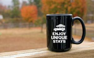 a black coffee mug with a car on it at Rivers Ledge Cabin with breathtaking views hot tub & indoor pool in Bryant +51 photos