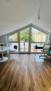 an empty living room with a table and chairs at Luxury Apartment in Böblingen in Böblingen