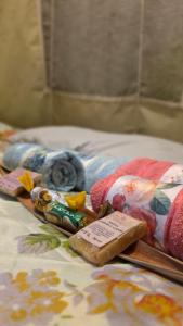 a bed with a bunch of different items on it at Aconchego Gaia in Alter do Chao