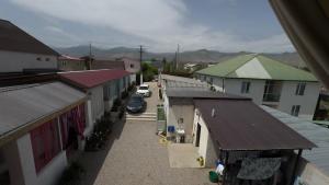 an aerial view of a small town with buildings at Guest house Stella in Cholpon-Ata