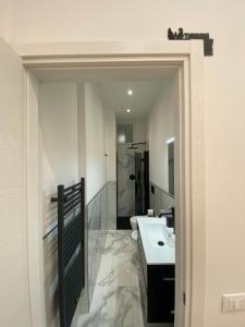 a bathroom with a sink and a mirror at Mare Montenotte in Savona +36 photos