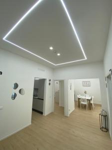 a white room with a table and a dining room at Mare Montenotte in Savona