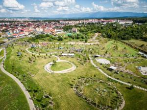 an aerial view of a park with a city in the background at Warm Studio in Sibiu