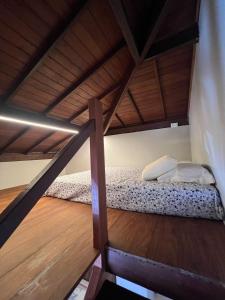a bunk bed in a room with a wooden floor at Vila Do Pescador in Barra Grande +41 photos