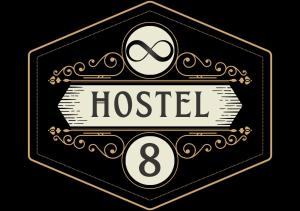 a black and gold hotel sign with a hostel at Hostel 8 in Pristina
