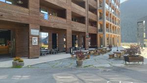 a courtyard with benches and tables in a building at Hytte i Myrkdalen in Helgatun
