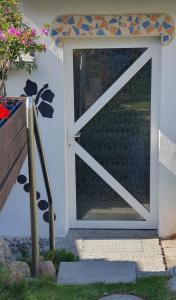a sliding glass door with a window on a house at Ferienwohnung Stein in Sassnitz