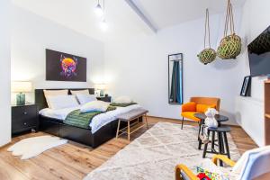 a bedroom with a bed and a table and chairs at Ama Apartament - Cota 1000 Sinaia in Sinaia