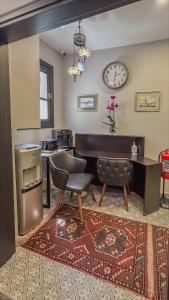 a living room with a piano and a chair at Balat Side Apart in Istanbul