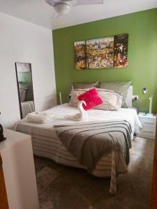 a bedroom with a bed with a red hat on it at RUIDERA HOLIDAY in Ruidera +44 photos