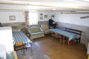 a living room with two tables and a couch at Hillside Farm Dormitory - Hikers, Cyclists and Explorers in Carlisle
