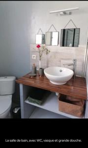 a bathroom with a sink and a toilet at Maison à 50m de la plage in Gâvres