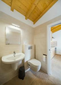 a bathroom with a sink and a toilet at One Bedroom Chalet with private bathroom and kitchen in Alcobaça