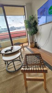 TV a/nebo společenská místnost v ubytování Refugio Bellavista vista al Costanera y los Andes