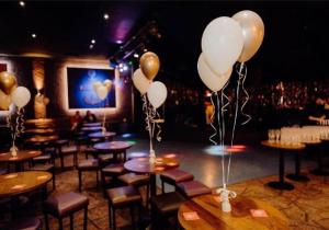 a room with tables and balloons in a bar at MLF caravan rental marine holiday park in Rhyl +34 photos