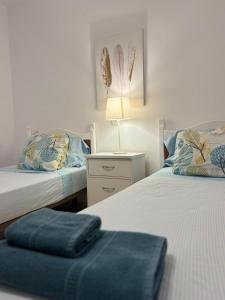 En eller flere senge i et værelse på Apartamento Sofia