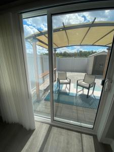 a view of a patio through a sliding glass door at Guest Suite in Ottawa in Ottawa