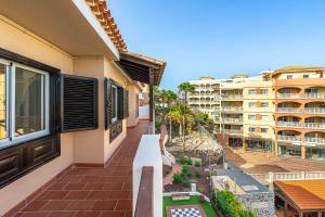 a balcony with a view of a building at As de Casas - Parque Albatros 2 in San Miguel de Abona