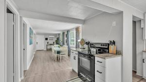 a kitchen with white counters and a stove top oven at Fall Break Specials! 4 Beds; Great for Lake Myrtle in Auburndale