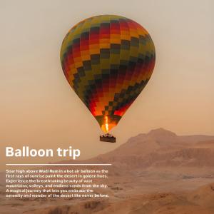 a hot air balloon flying over the desert at Sofia Valley Camp in Wadi Rum
